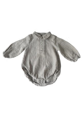 Light grey baby muslin romper, made from breathable and sustainable cotton fabric, ethically produced. Shop the best baby clothing and gifts online.