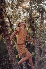 GRECH & CO boys swim trunks in Sienna Gingham are made with sustainable recycled material, providing UPF 50+ sun protection and ultra-comfortable online.