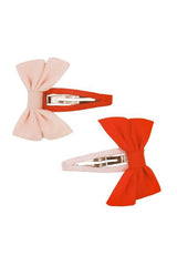 Girl's bow hair clips in pink and red are perfect for adding a delicate touch to any outfit! The girl's snap clip is gentle on hair yet has a strong grip.