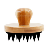 Wooden brush with black bristles on a white background