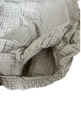 Light grey baby muslin romper, made from breathable and sustainable cotton fabric, ethically produced. Shop the best baby clothing and gifts online.