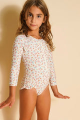 The long sleeve swimsuit in Sunset Meadow, made from recycled fabric and offering UPF 50+ protection, this sustainable girl swimsuit is trendy and practical.