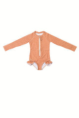 The long sleeve swimsuit for girls with rashguard and ruffle in Sienna Gingham by Grech and Co. Shop the best sustainable girl swimsuit online at MiliMilu.