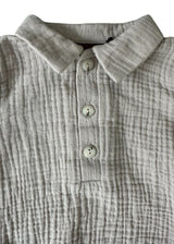 Light grey baby muslin romper, made from breathable and sustainable cotton fabric, ethically produced. Shop the best baby clothing and gifts online.