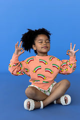 Shop girls & tweens organic cotton sweaters with a modern twist - long puff sleeves in peach colour with stars. Sweater for spring and summer in bright colours.
