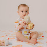 baby holding the wee bean fairtrade rattle dolls