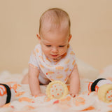 cute baby drooling wearing the wee bean's bakery buns bib and onesie