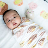 cute baby swaddled in the wee bean dim sum swaddle