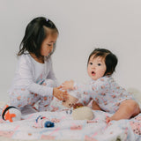 sisters playing in their boba pajamas