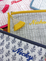 Malabar Baby toiletry vanity kit set with personalized embroidery and beautiful block-printed designs. Made from 100% Indian cotton voile, quilted for durability, with YKK zippers and non-toxic, water-based inks. Includes large and small pouches—perfect for organizing essentials.