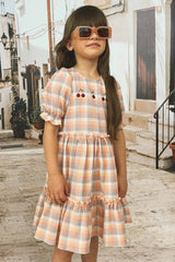 Puffed sleeve dress for girls with ruffle skirt makes a perfect girl summer dress. Making it perfect for kids summer clothing collection. Best girl dresses.