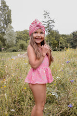 girls pink swimsuit in romance print is must have by Louise Misha. Made from SPF 50 sun-protective recycled fabric. Mini Me swimwear is available.