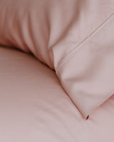 Close-up of Jaipur Sunset Pillowcase ad fitted sheet