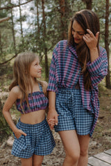The blue checked shorts are loose-fitted with a drawstring to adjust. Match it with women oversized shirt for the full look! Mommy and Me fashion is available.