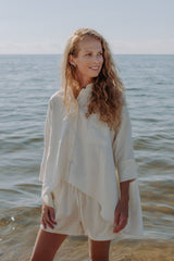 High quality women oversized linen shirt in off white, this oversized shirt is made from breathable linen fabric. Get linen shorts for women linen set.