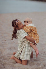 Grech & Co organic cotton towel poncho in fern green is the perfect blend of comfort. The retro-inspired hooded beach poncho for kids, shop kids beach clothing.