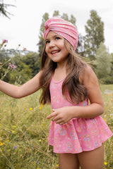 girls pink swimsuit in romance print is must have by Louise Misha. Made from SPF 50 sun-protective recycled fabric. Mini Me swimwear is available.