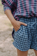 The blue checked shorts are loose-fitted with a drawstring to adjust. Match it with women oversized shirt for the full look! Mommy and Me fashion is available.