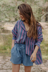The blue checked shorts are loose-fitted with a drawstring to adjust. Match it with women oversized shirt for the full look! Mommy and Me fashion is available.