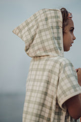 Grech & Co organic cotton towel poncho in fern green is the perfect blend of comfort. The retro-inspired hooded beach poncho for kids, shop kids beach clothing.
