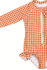The long sleeve swimsuit for girls with rashguard and ruffle in Sienna Gingham by Grech and Co. Shop the best sustainable girl swimsuit online at MiliMilu.