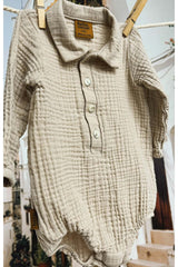 Light grey baby muslin romper, made from breathable and sustainable cotton fabric, ethically produced. Shop the best baby clothing and gifts online.