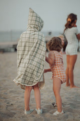 Grech & Co organic cotton towel poncho in fern green is the perfect blend of comfort. The retro-inspired hooded beach poncho for kids, shop kids beach clothing.