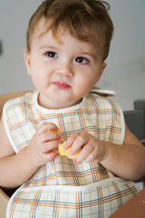 Sustainable baby bib in plaid pattern is water-resistant recycled Oeko tex material. Stylish and practical baby bib for being on the go. Best baby accesories