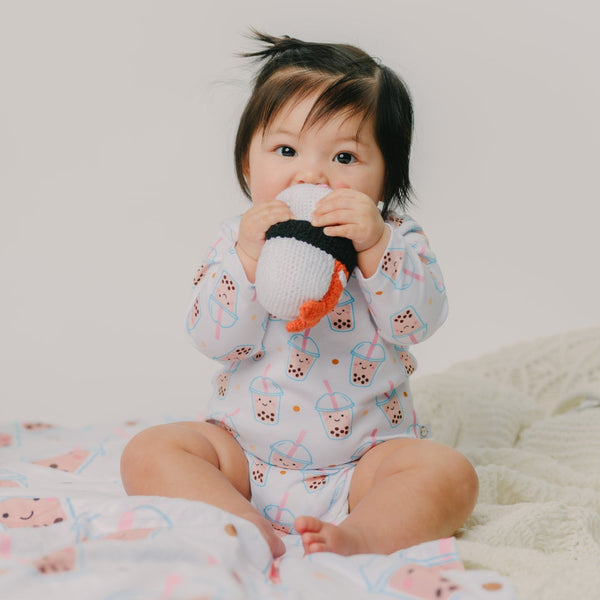 cute baby chewing on the wee bean fair-trade handmade dolls in shrimp ebi sushi