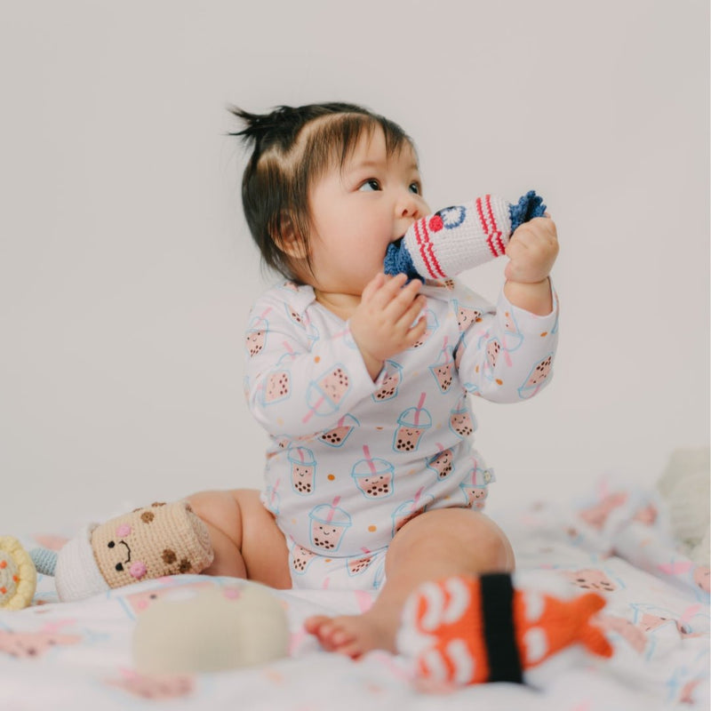 cute baby chewing on the wee bean bunny candy crochet rattle doll
