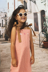 Girls pink plaid dress features adjustable straps & a free fit, making it the perfect summer dress & part of our sustainable kids clothing collection online.