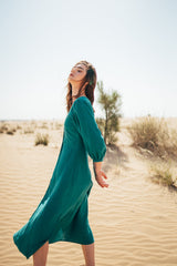 Midi length loose emerald green 100% linen dress.