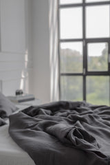 Close Up Of Bed With Charcoal Linen Bedding Set