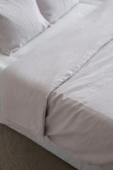 Close Up of Bed With Cream Linen Duvet Cover By AmourlInen